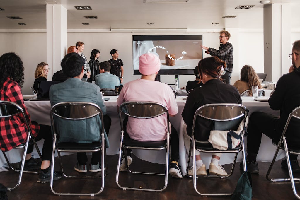 Man Giving a Presentation to a Group of People